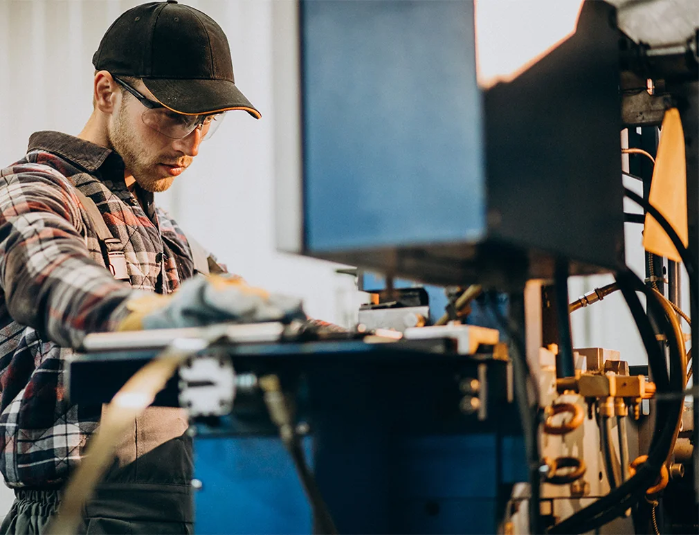Worker using the new Cut-N-Crown jig system from Outlaw Tool Co. for precise crown molding cuts